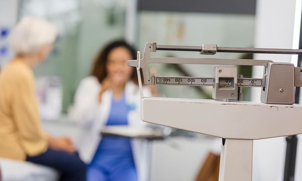 woman and her doctor in New Jersey discussing "weigh-in" anxiety