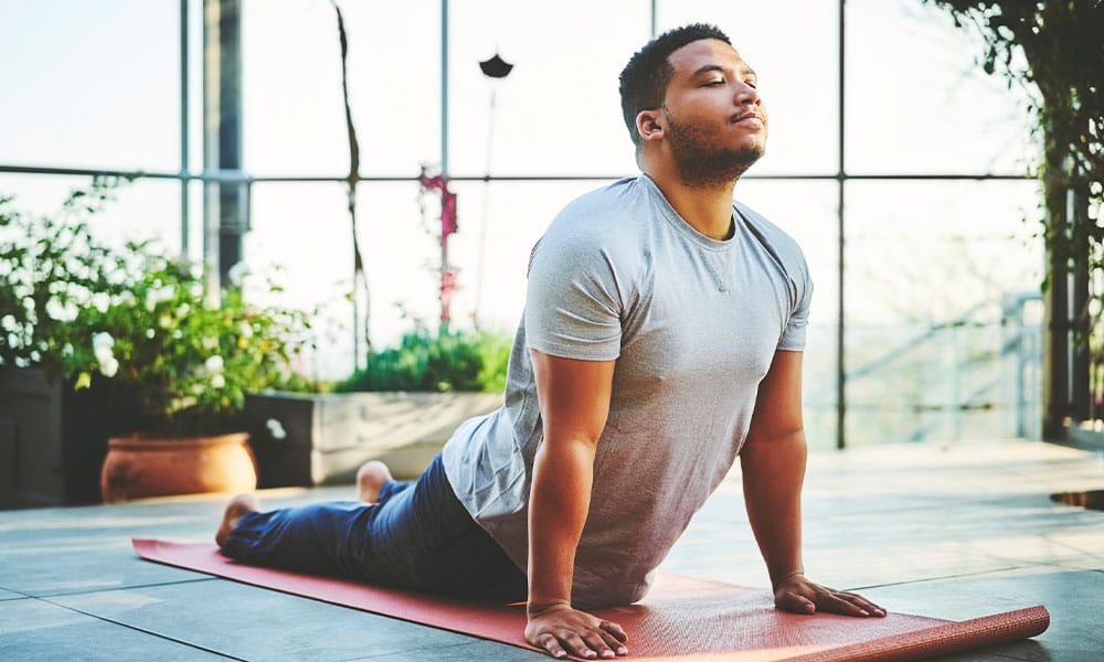 man doing yoga after weight loss surgery in New Jersey