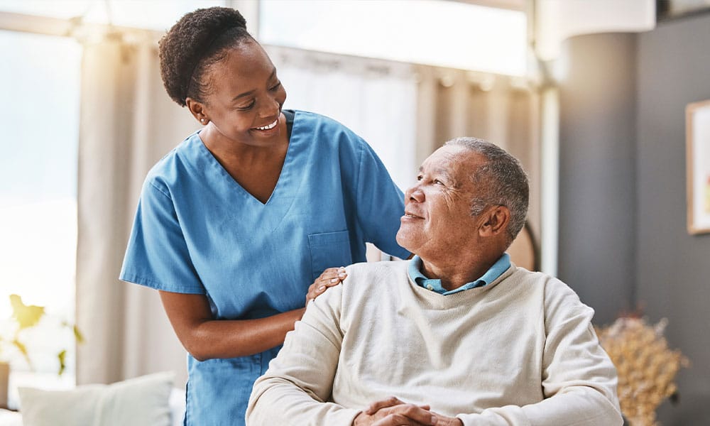 man at home with a caregiver after his gastrectomy in New Jersey
