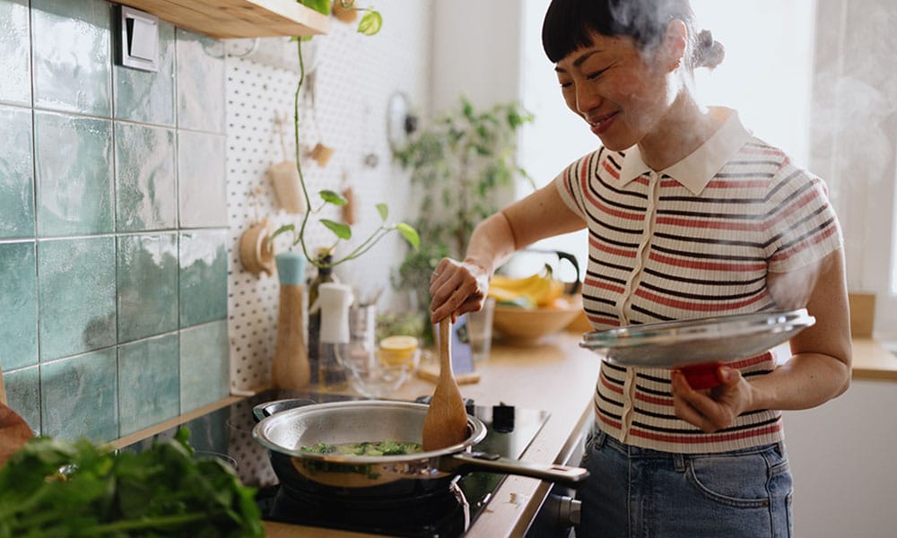 woman cooking a meal from a her nutritional counseling plan in New Jersey
